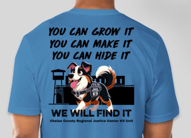 A man wears a t-shirt with a dog on it that reads, you can grow it, you can make it, you can hide it, we will find it.